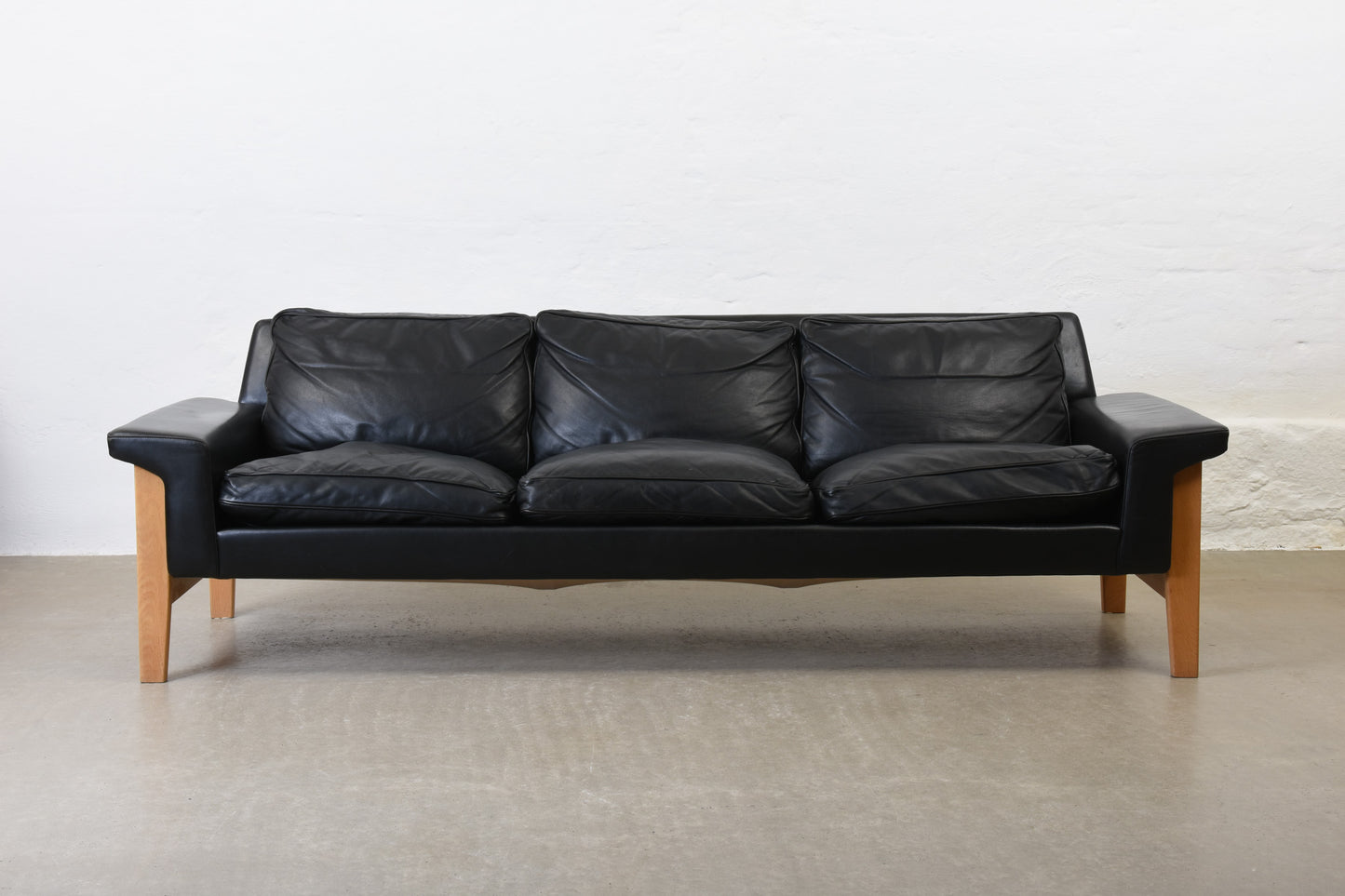 1960s leather + oak three seater by Ulferts