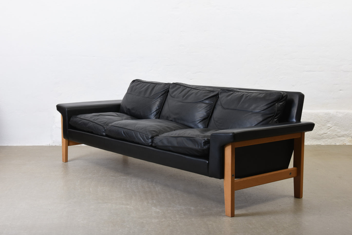 1960s leather + oak three seater by Ulferts