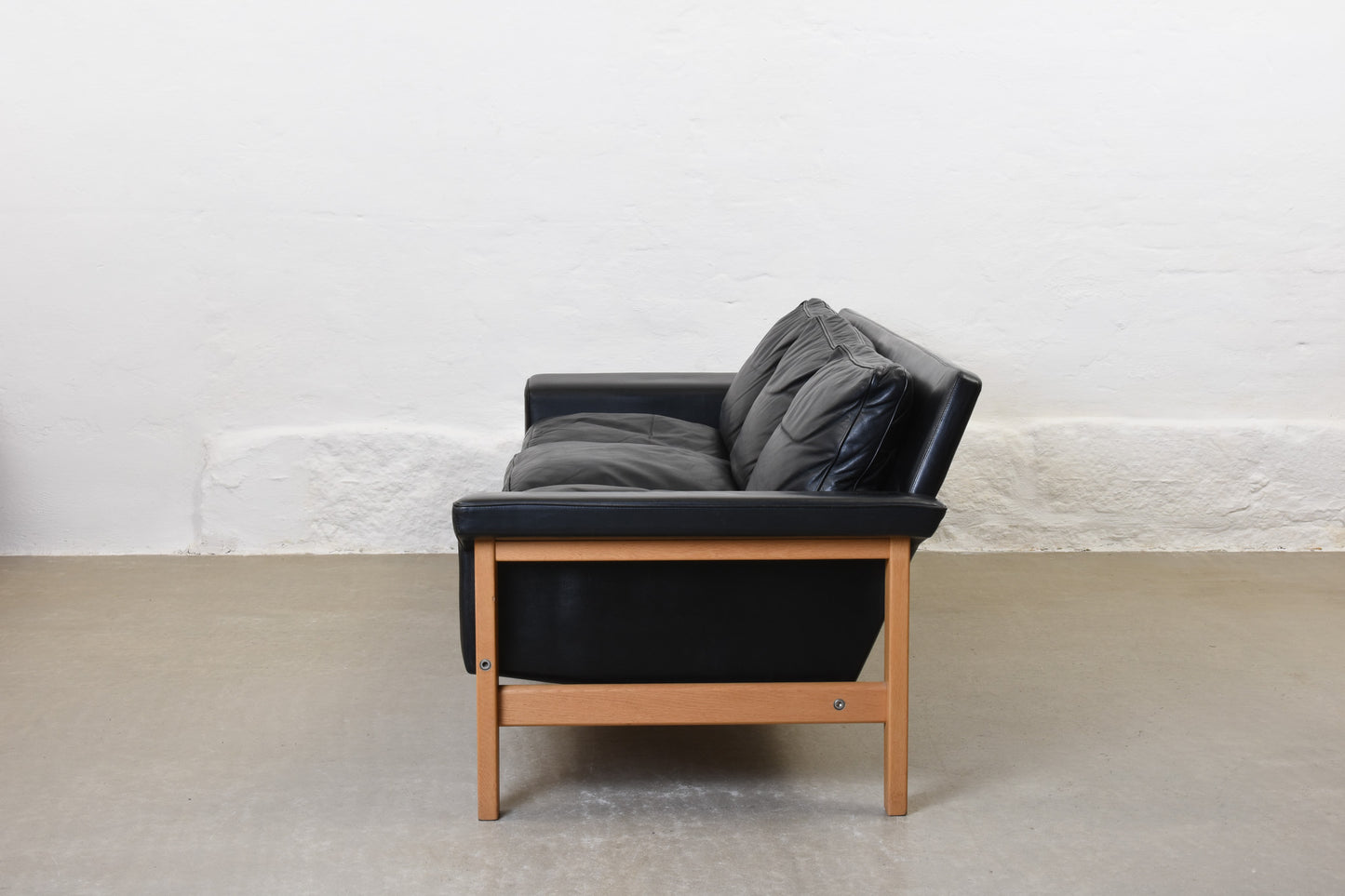 1960s leather + oak three seater by Ulferts