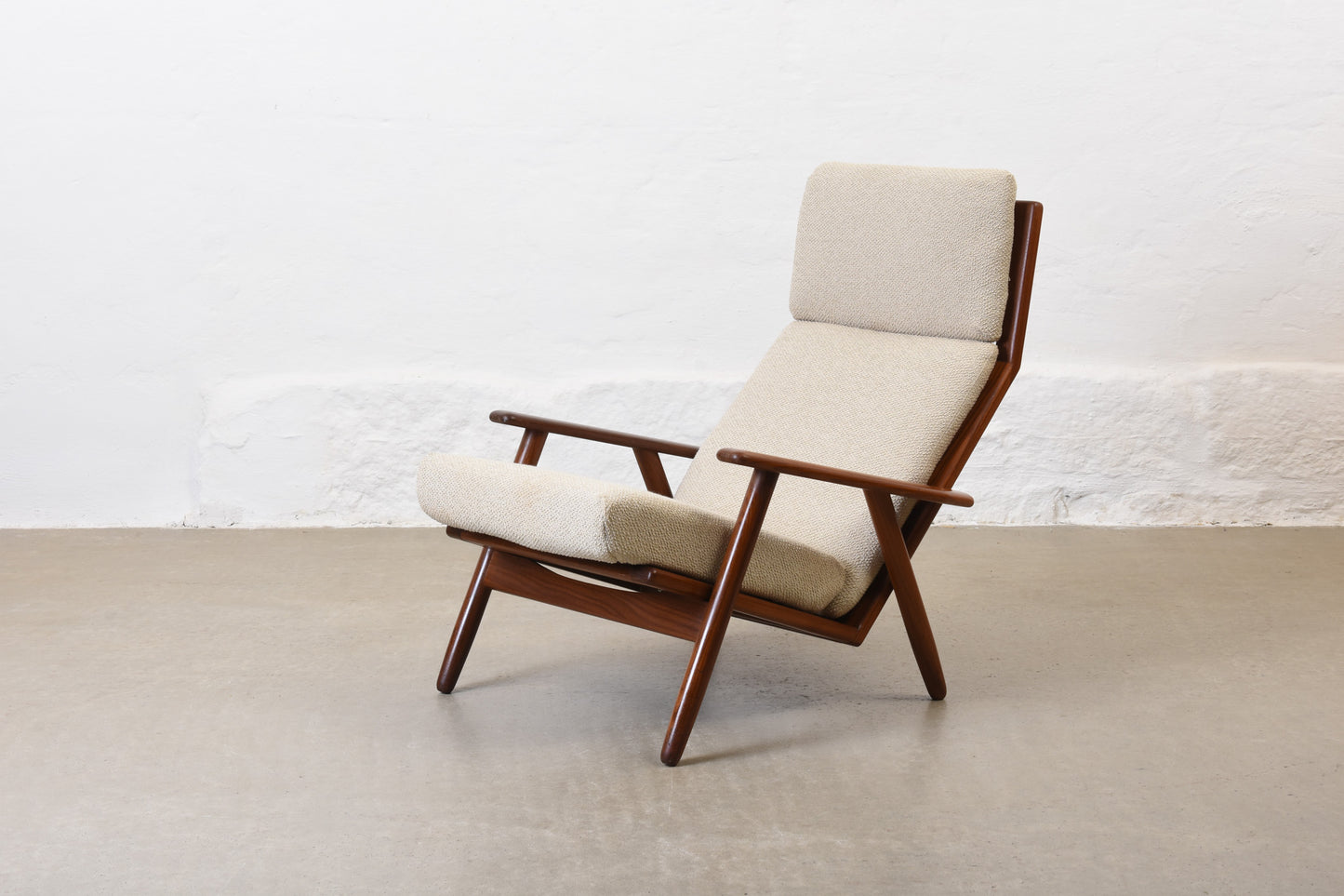 Newly reupholstered: 1960s high back teak lounger