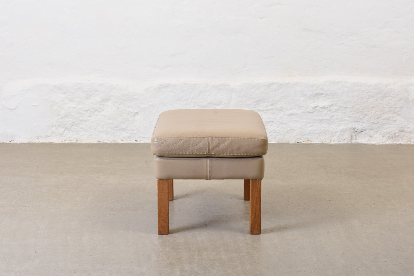 1980s leather foot stool on oak legs