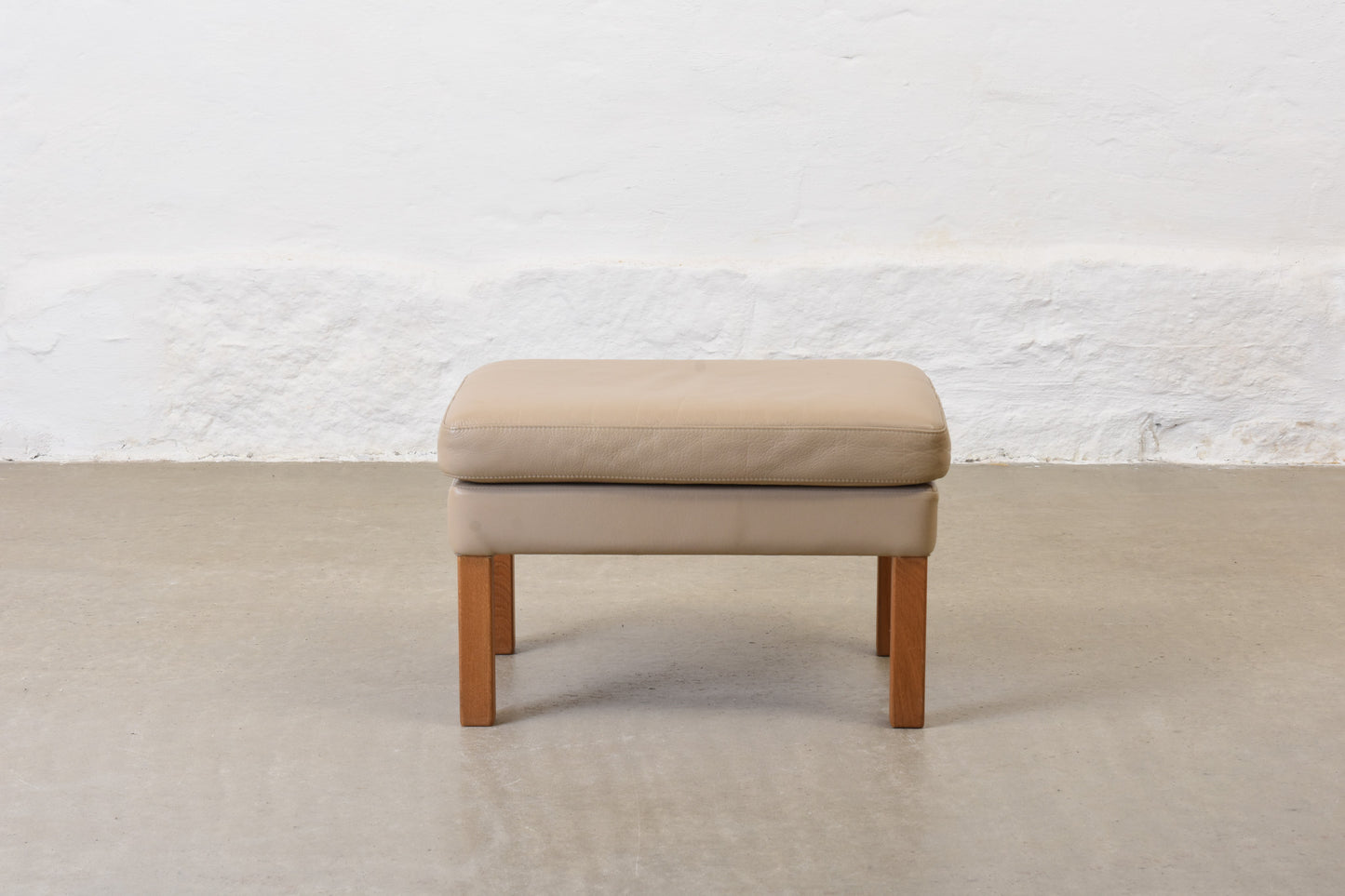1980s leather foot stool on oak legs