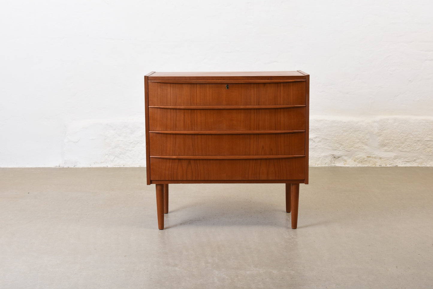 1960s low chest of four drawers in teak no. 1
