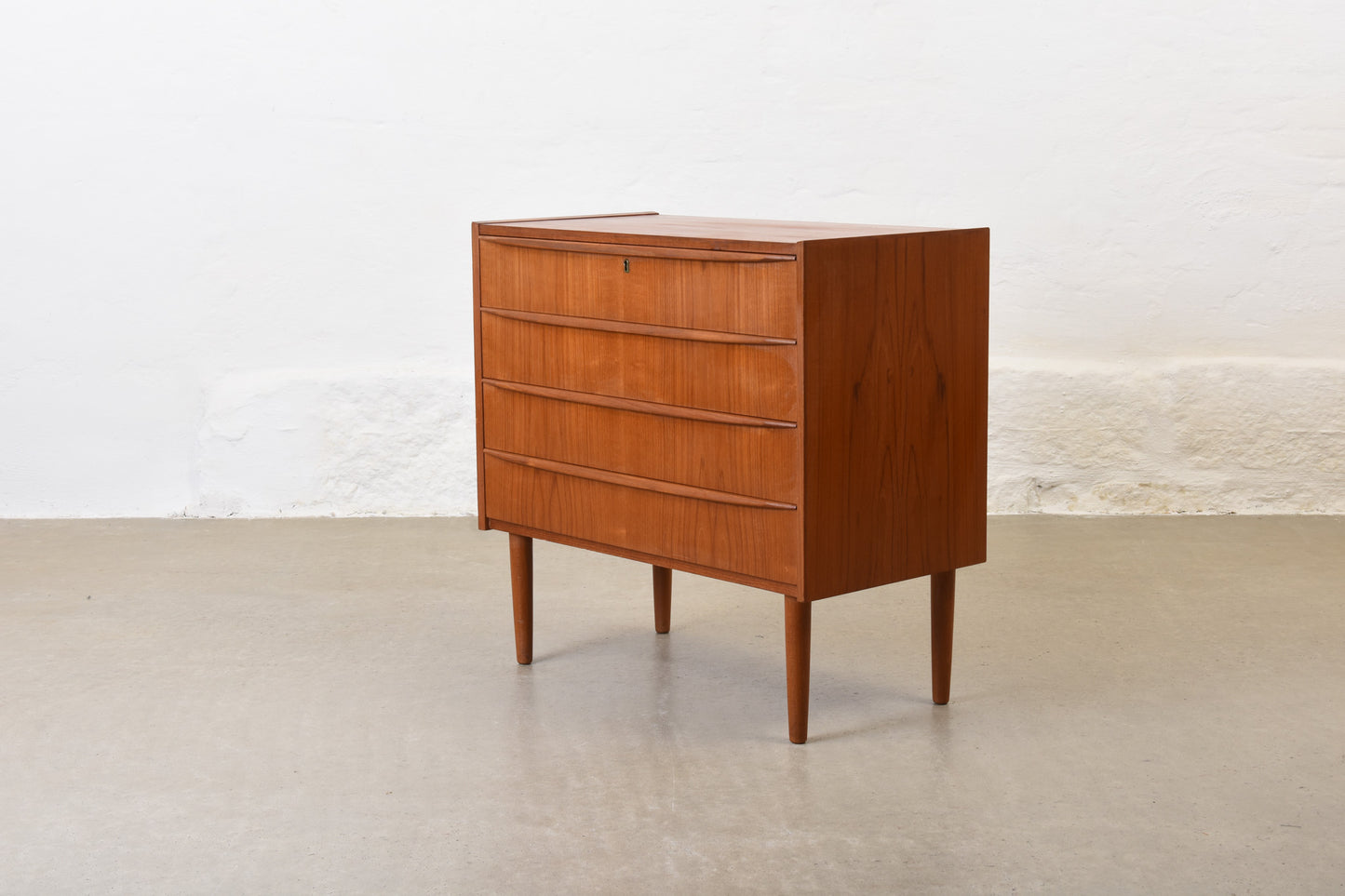 1960s low chest of four drawers in teak no. 1