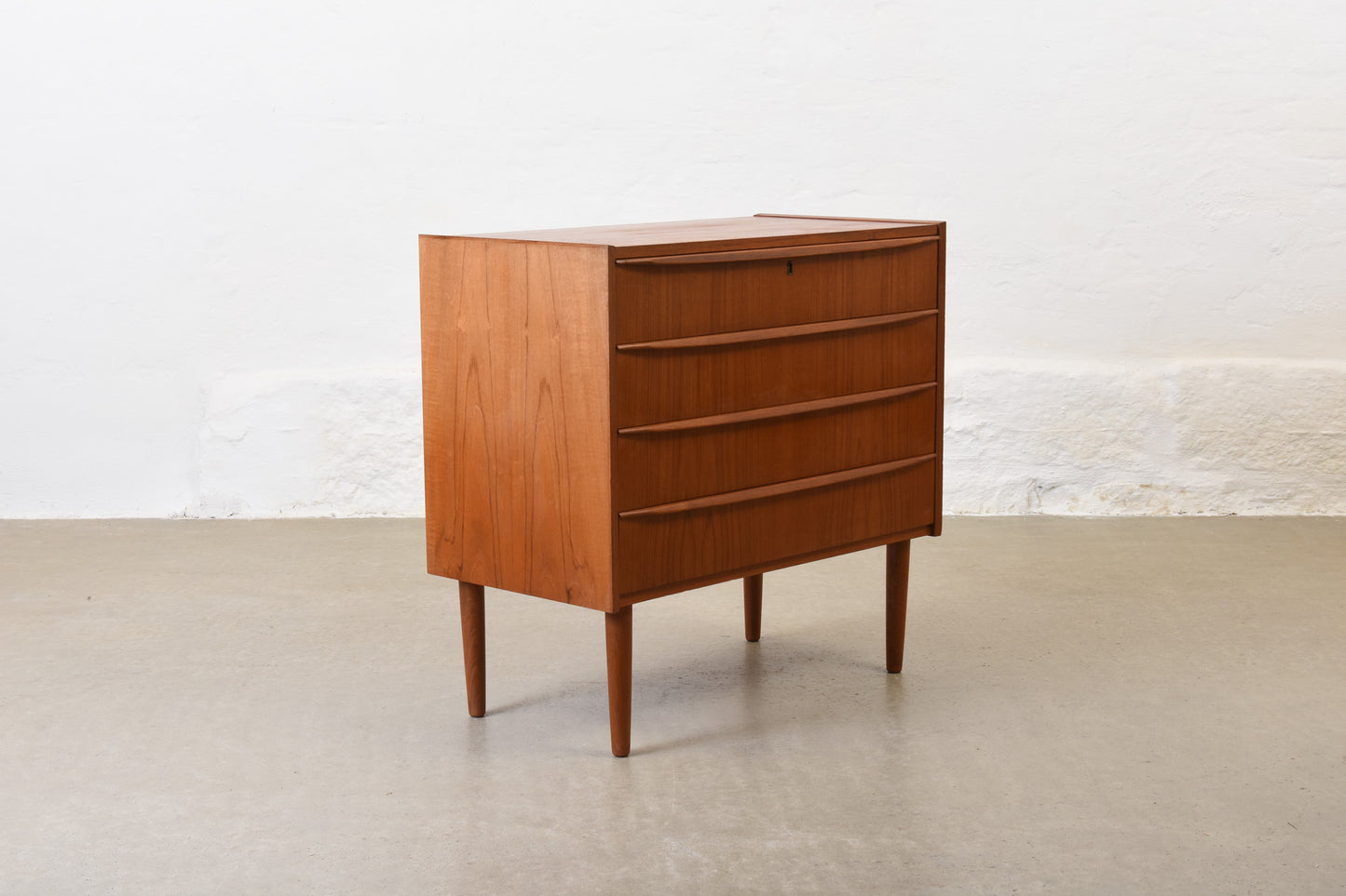1960s low chest of four drawers in teak no. 1