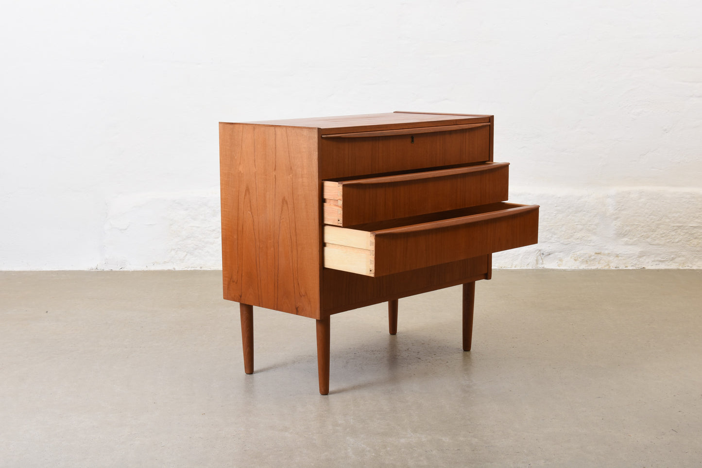 1960s low chest of four drawers in teak no. 1
