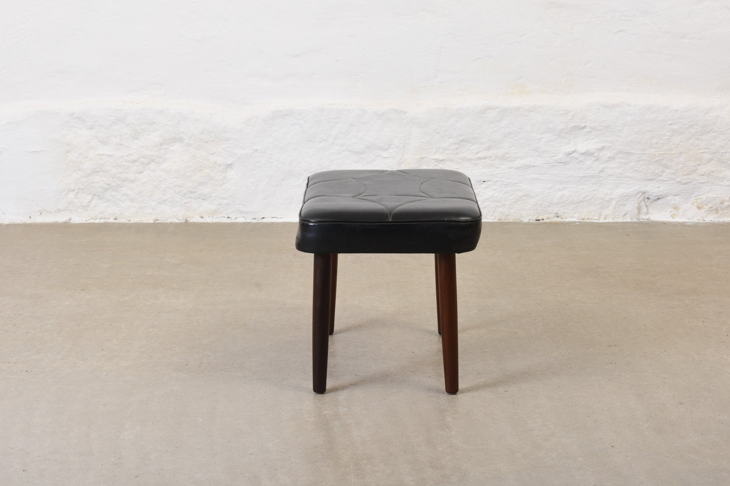 1960s vinyl footstool on teak legs