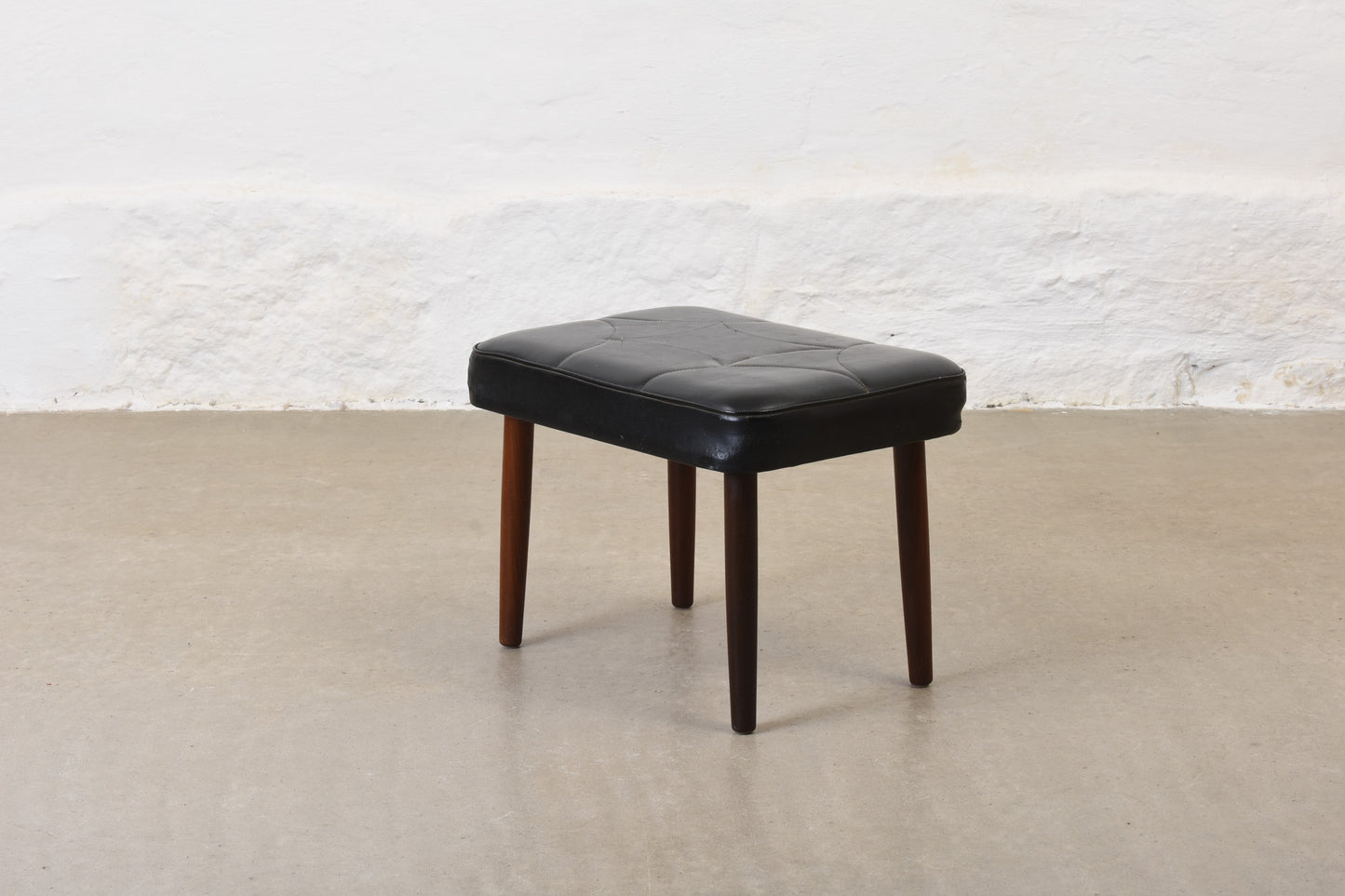 1960s vinyl footstool on teak legs