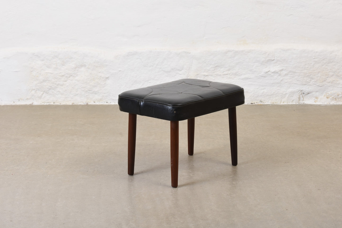 1960s vinyl footstool on teak legs