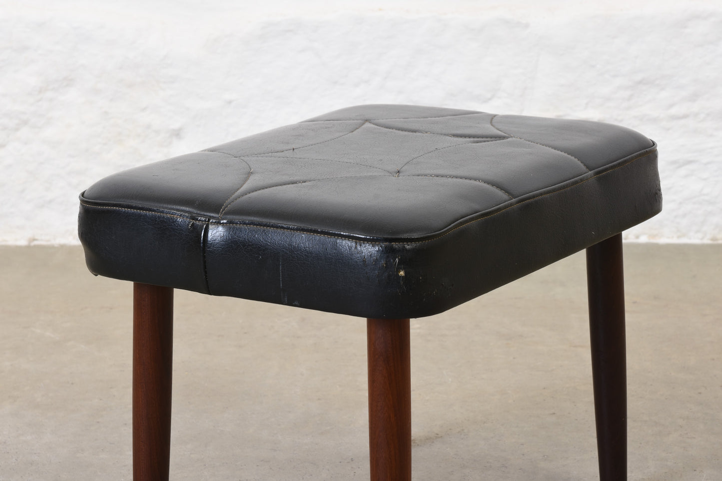 1960s vinyl footstool on teak legs