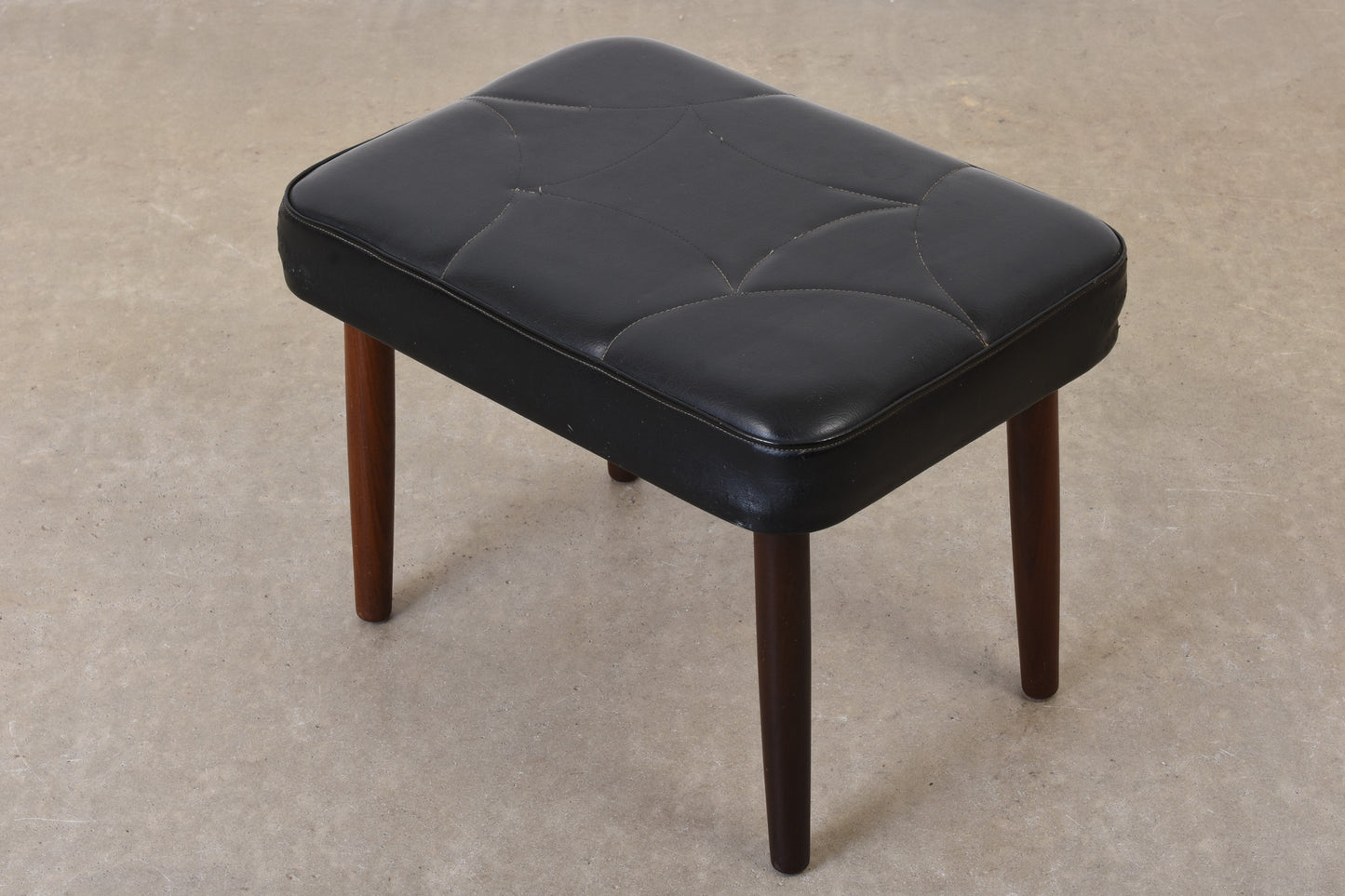 1960s vinyl footstool on teak legs