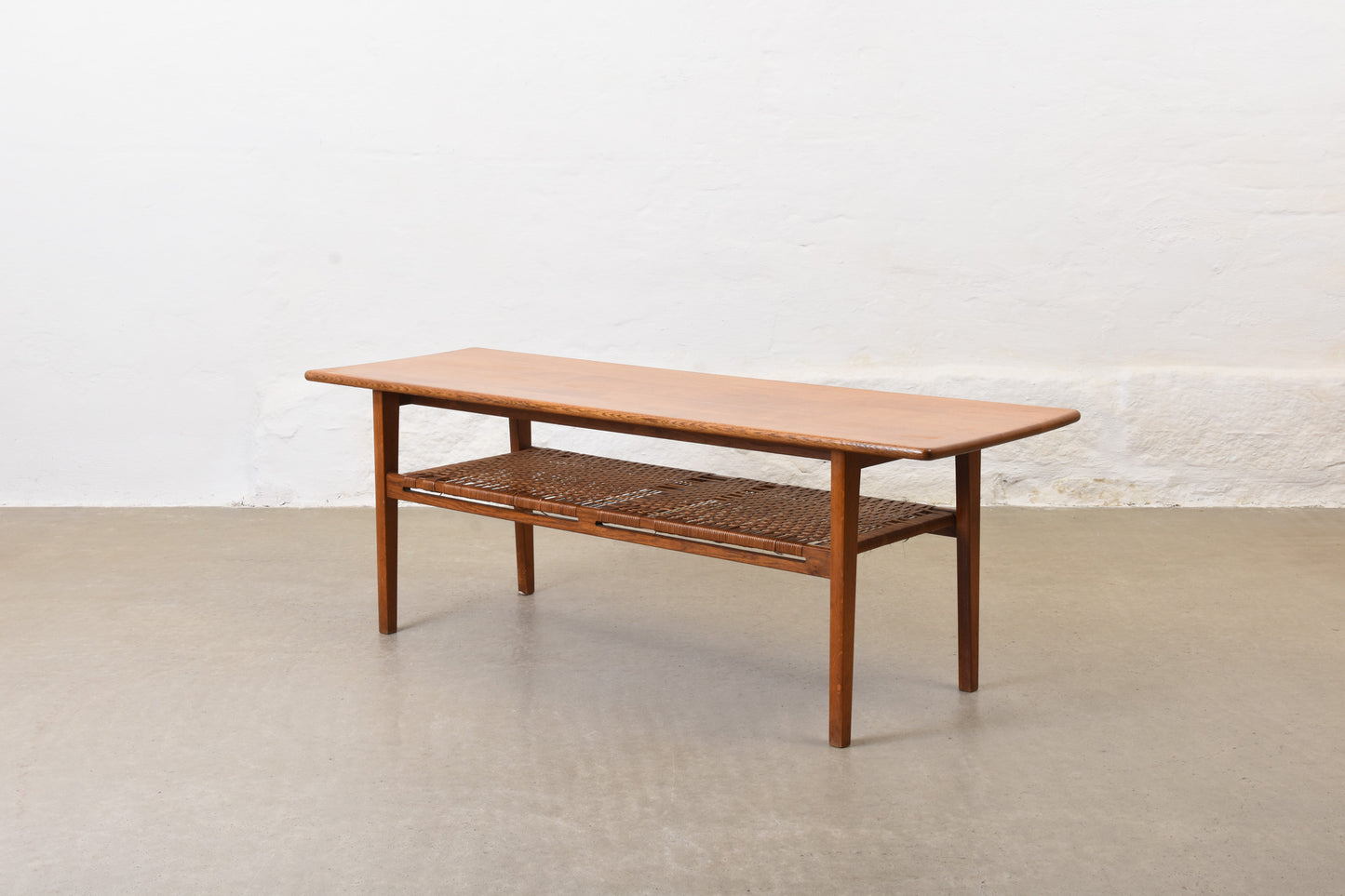 1960s oak coffee with cane magazine shelf
