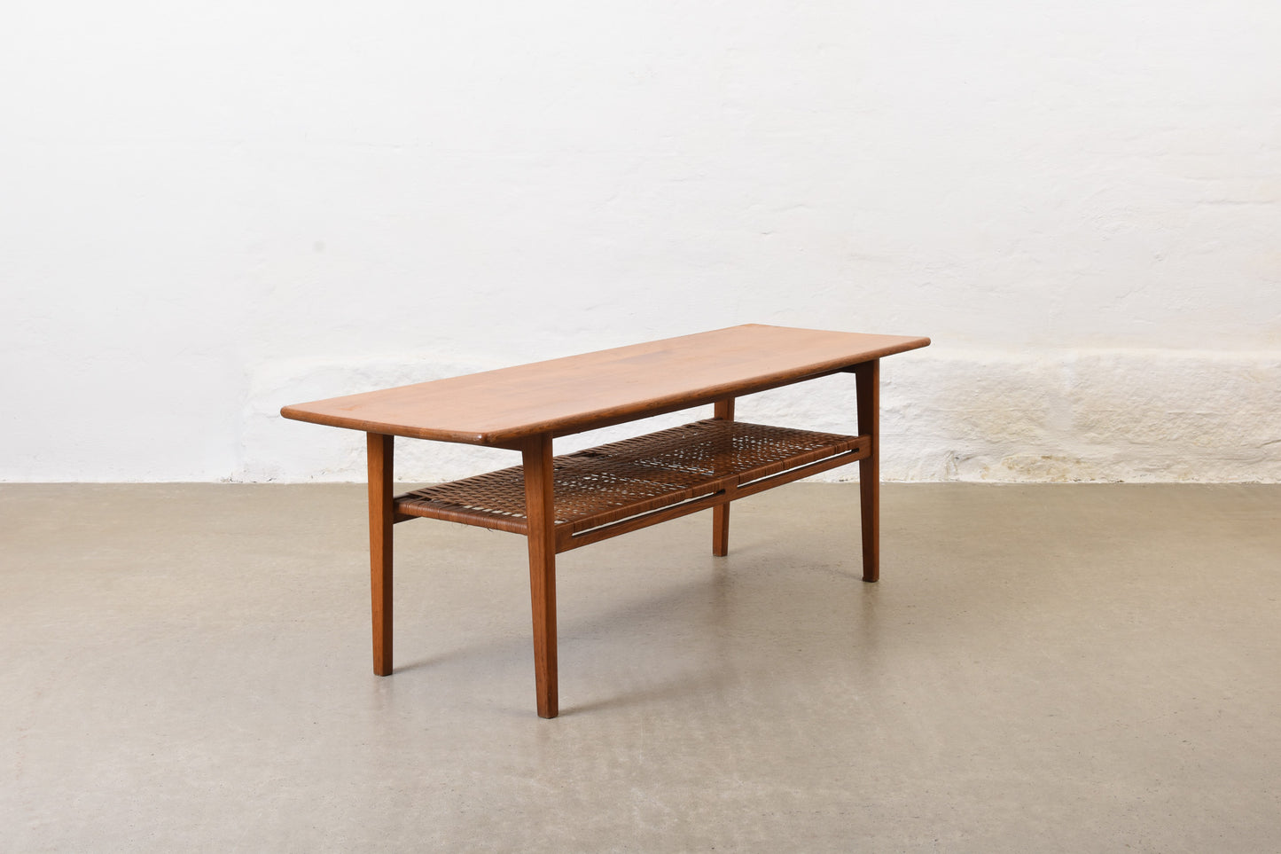 1960s oak coffee with cane magazine shelf