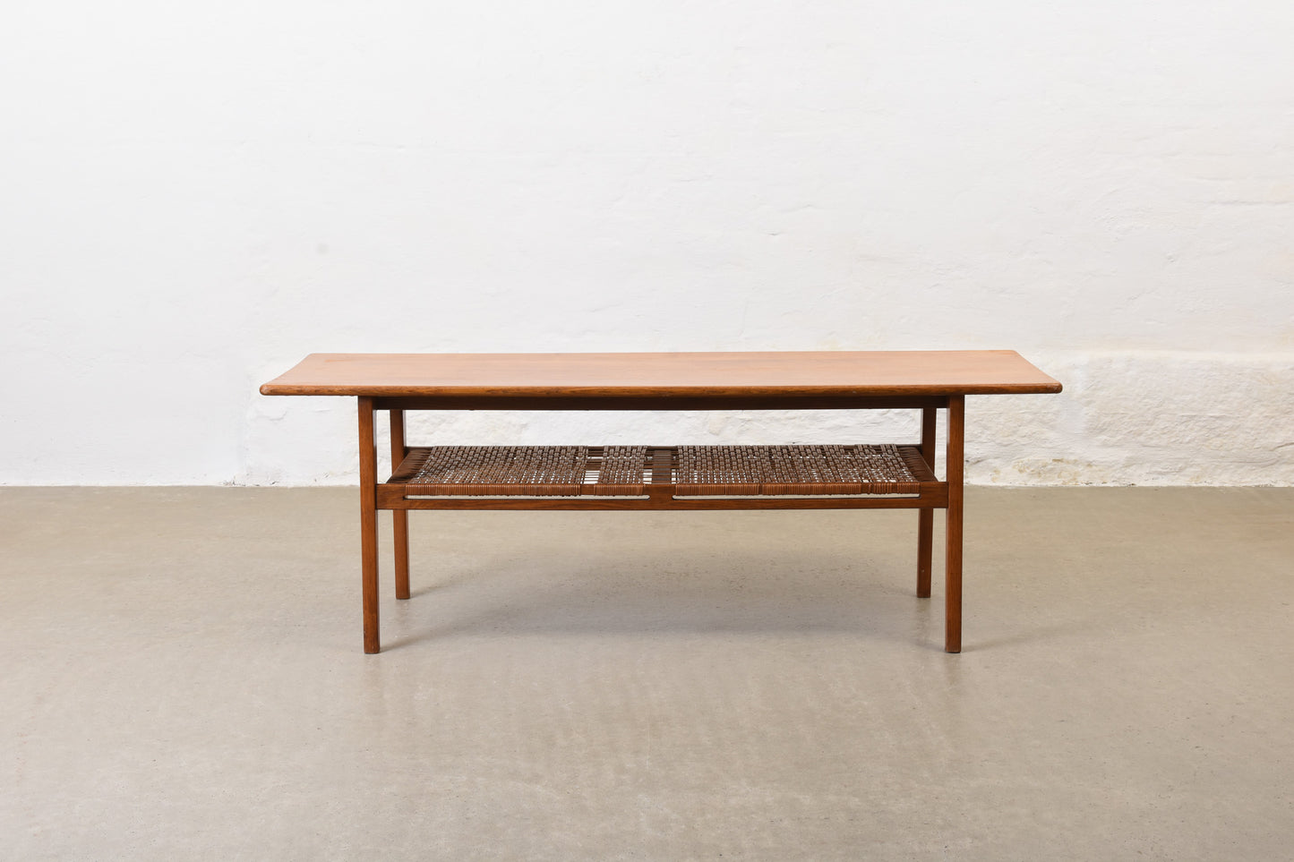 1960s oak coffee with cane magazine shelf