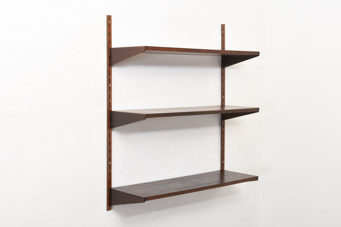 1960s bay of three rosewood shelves by Kai Kristiansen