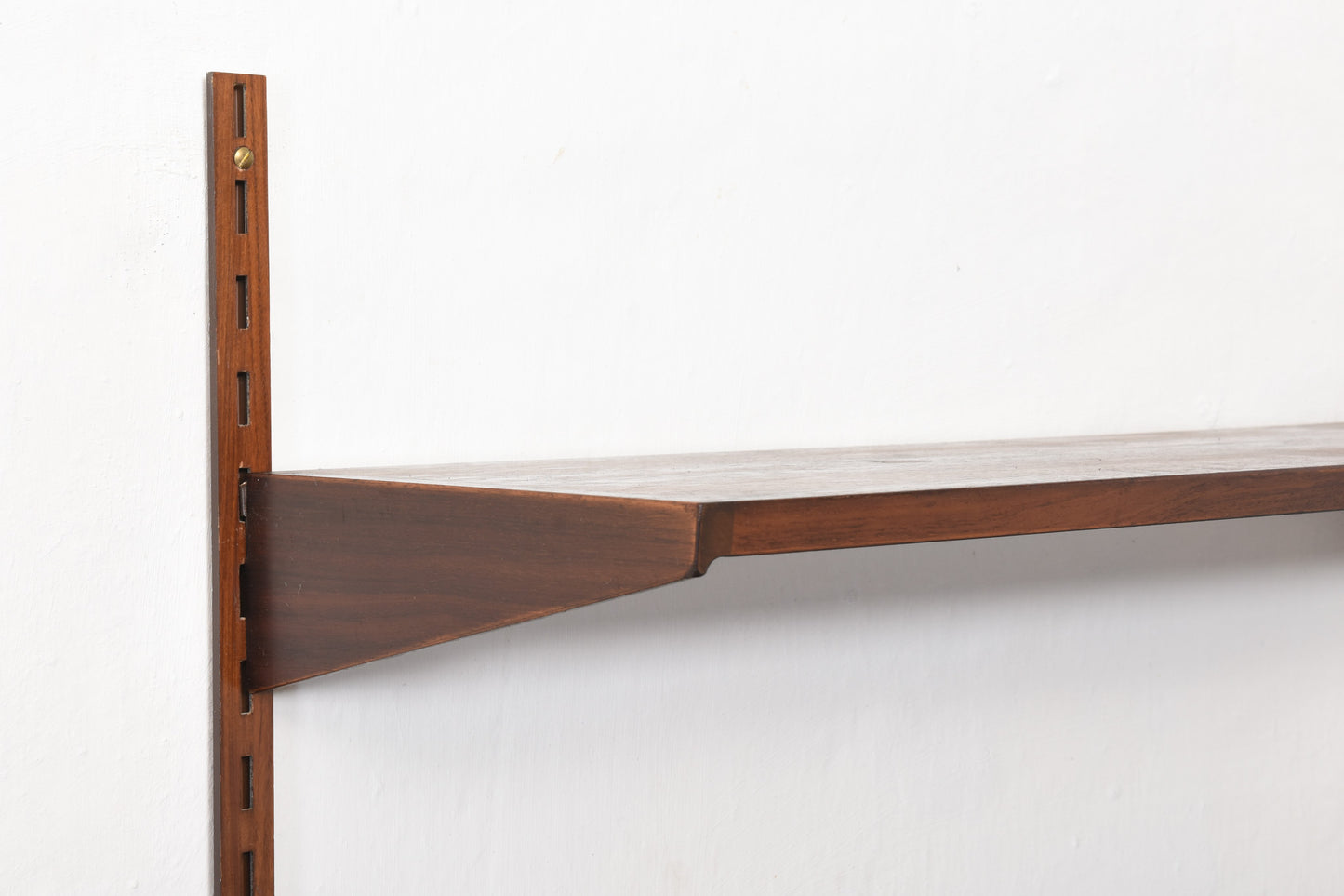 1960s bay of three rosewood shelves by Kai Kristiansen
