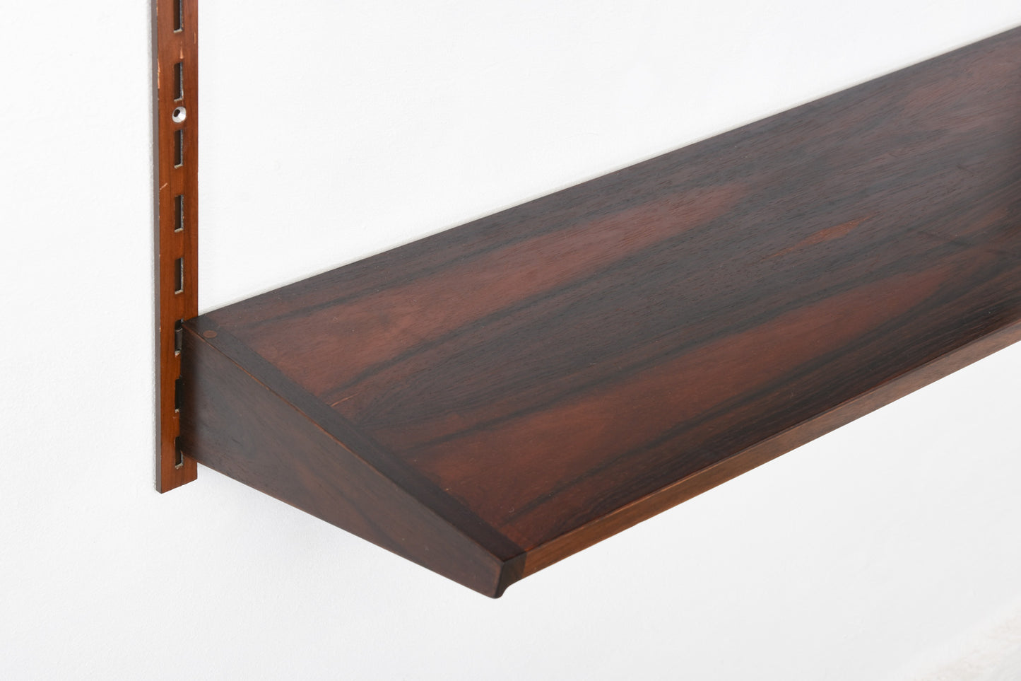 1960s bay of three rosewood shelves by Kai Kristiansen