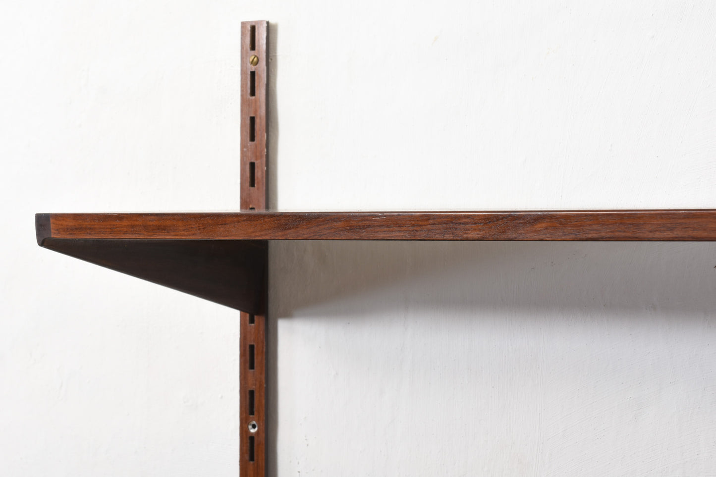 1960s bay of three rosewood shelves by Kai Kristiansen