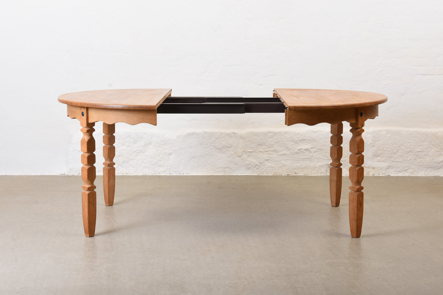 1970s extending oak dining table by Henning Kjærnulf