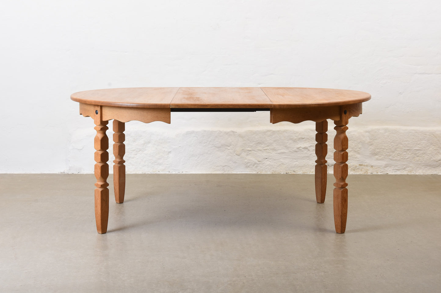 1970s extending oak dining table by Henning Kjærnulf
