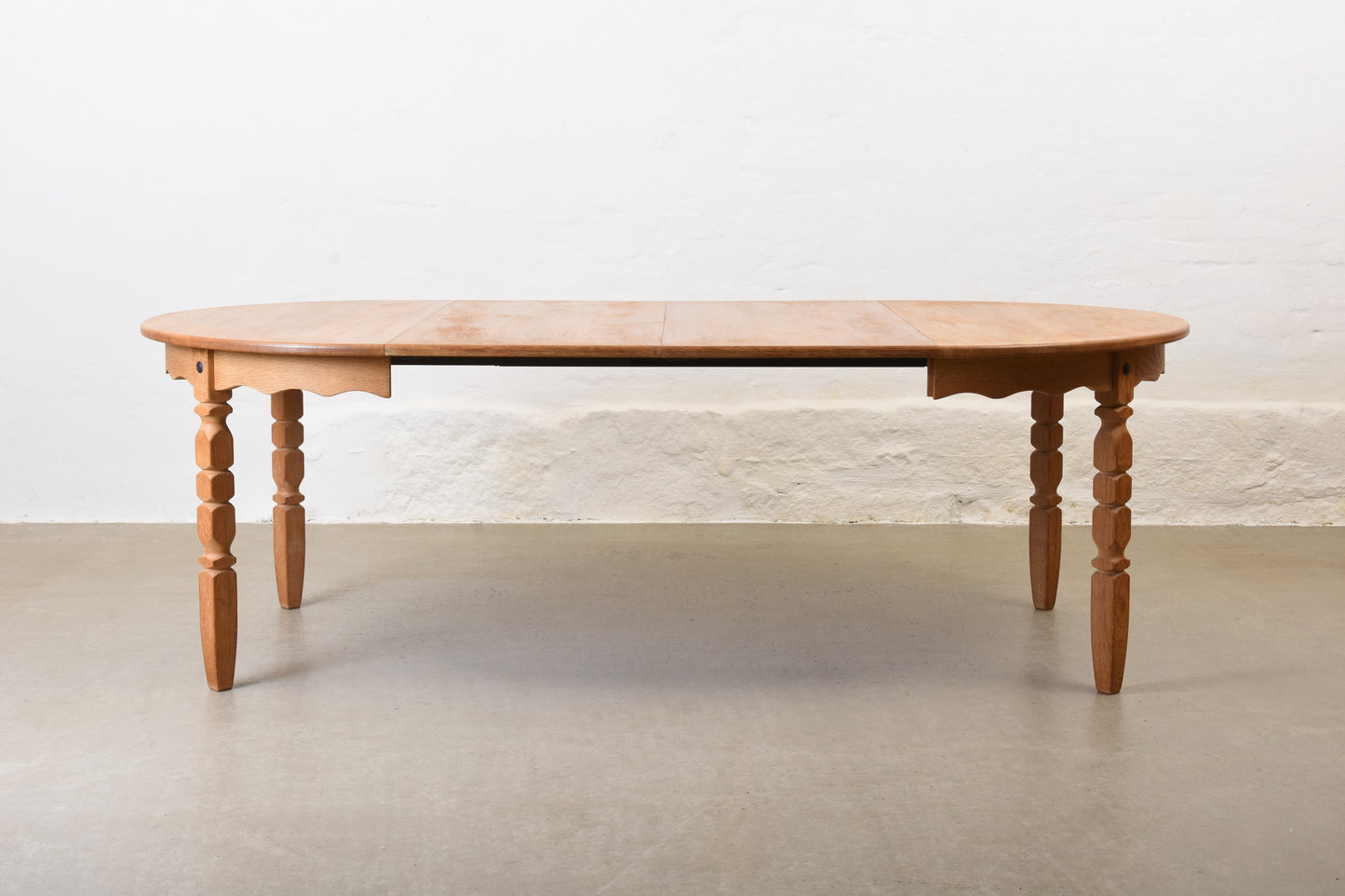 1970s extending oak dining table by Henning Kjærnulf