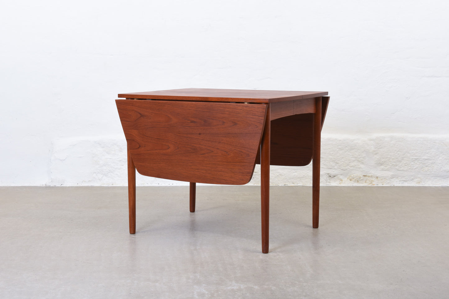 1960s extending dining table in teak with drop leaves