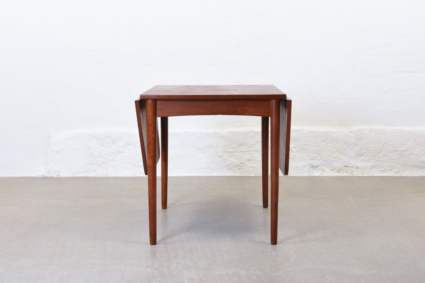 1960s extending dining table in teak with drop leaves