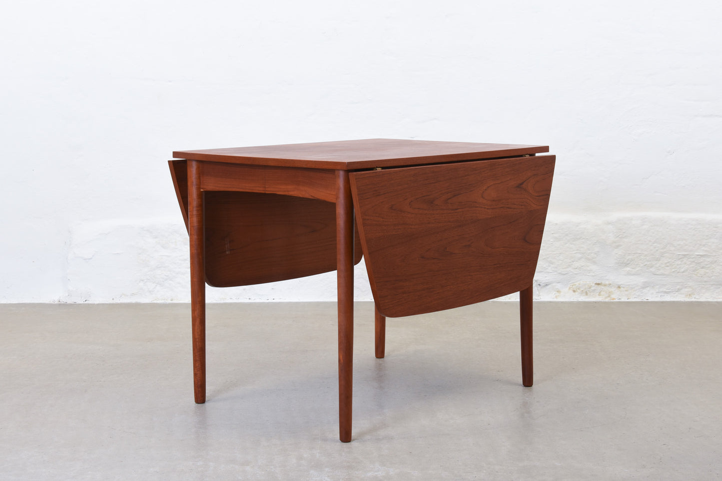 1960s extending dining table in teak with drop leaves