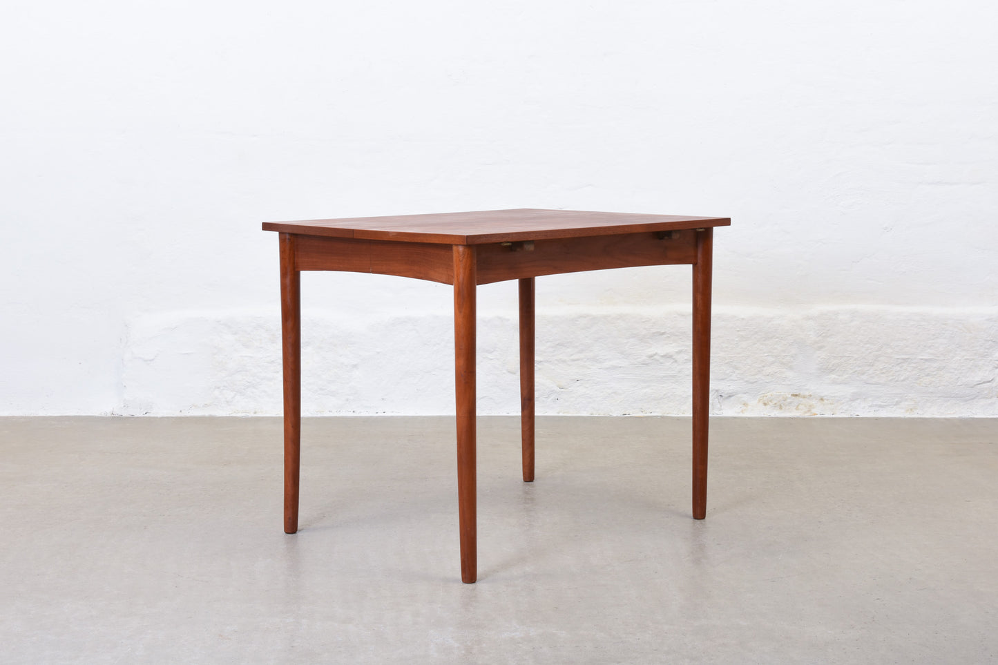 1960s extending dining table in teak with drop leaves