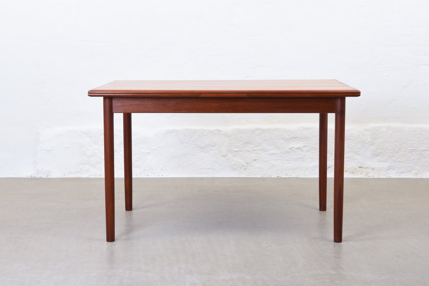 1960s extending dining table in teak by H. Sigh & Søn