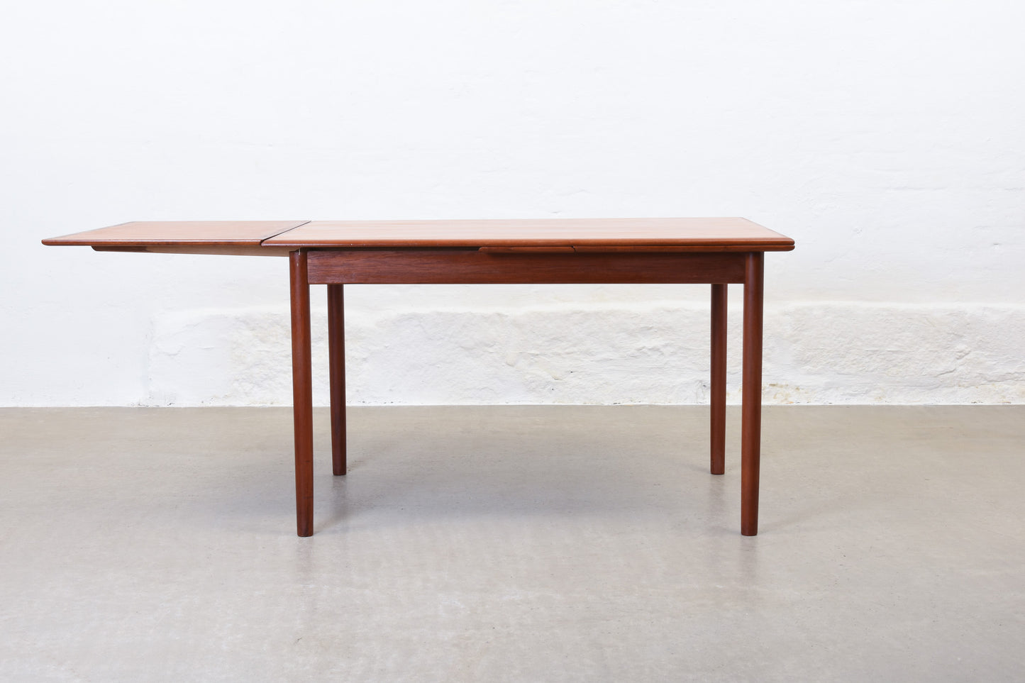 1960s extending dining table in teak by H. Sigh & Søn