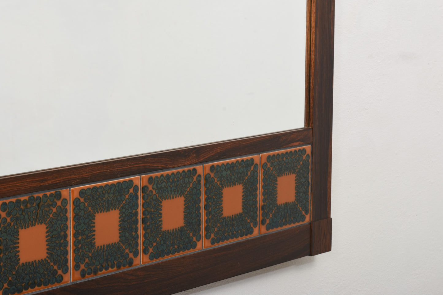 1970s rosewood mirror with ceramic inlay