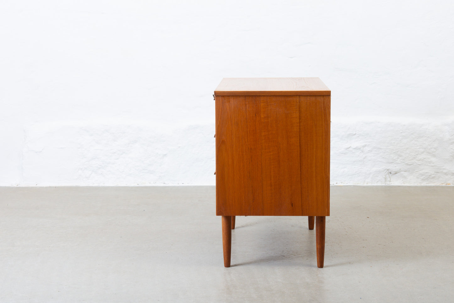 1960s low teak chest of three drawers - 65H cm