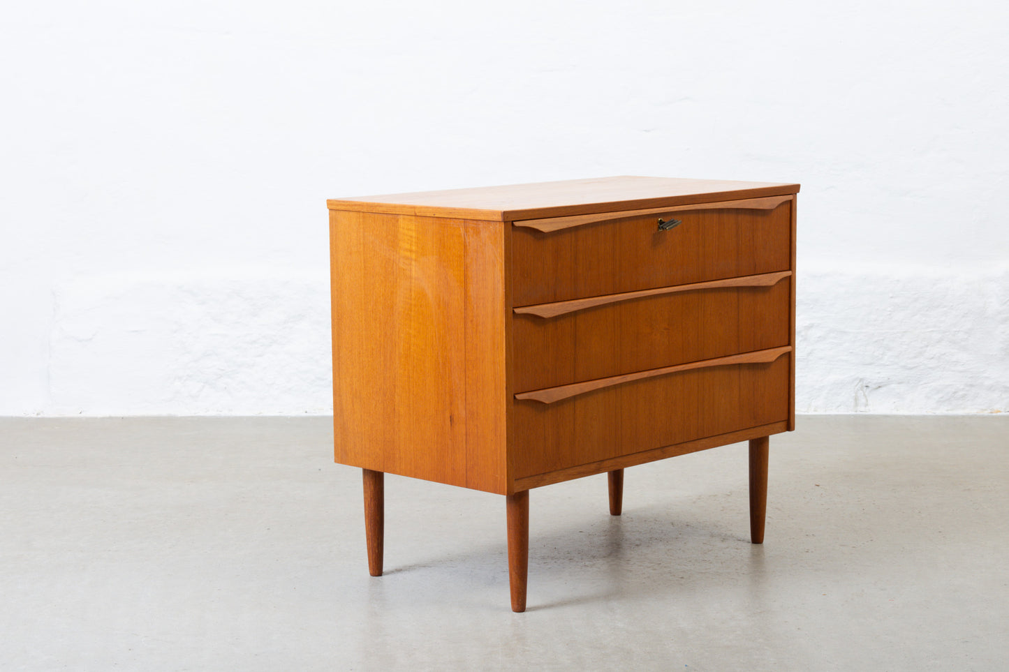 1960s low teak chest of three drawers - 65H cm