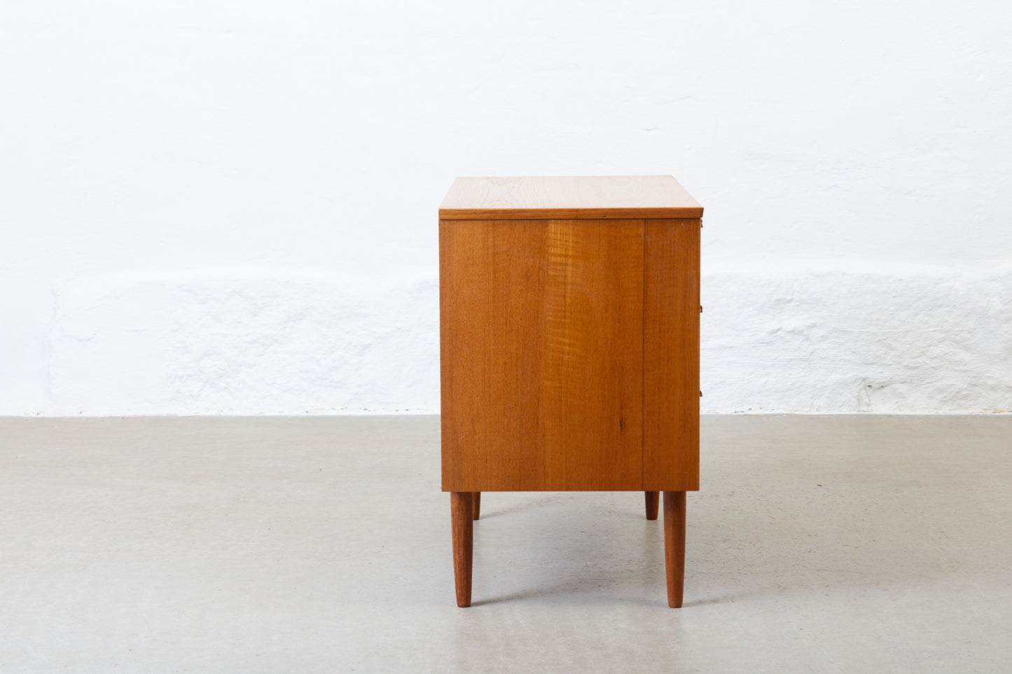 1960s low teak chest of three drawers - 65H cm