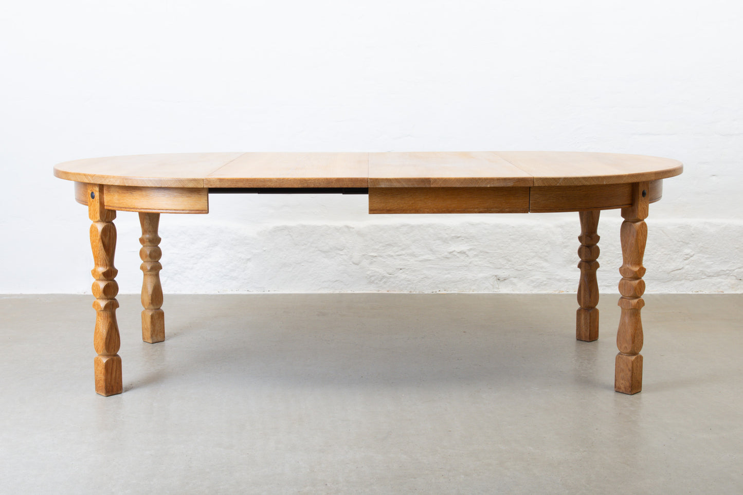 1970s extending circular dining table in oak