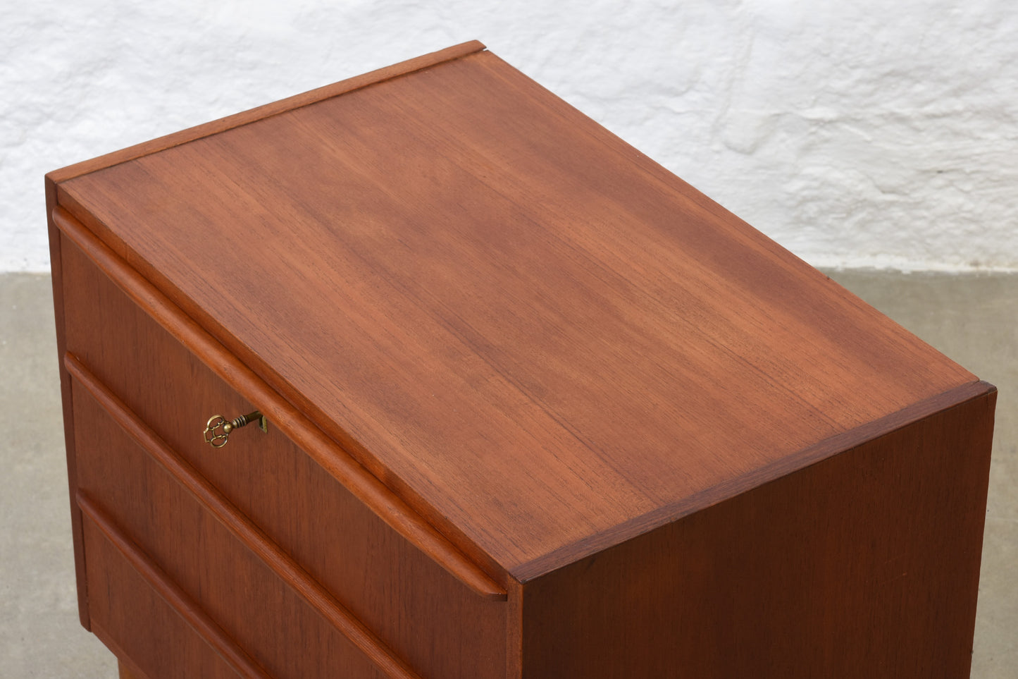 1960s low teak chest with lipped handles
