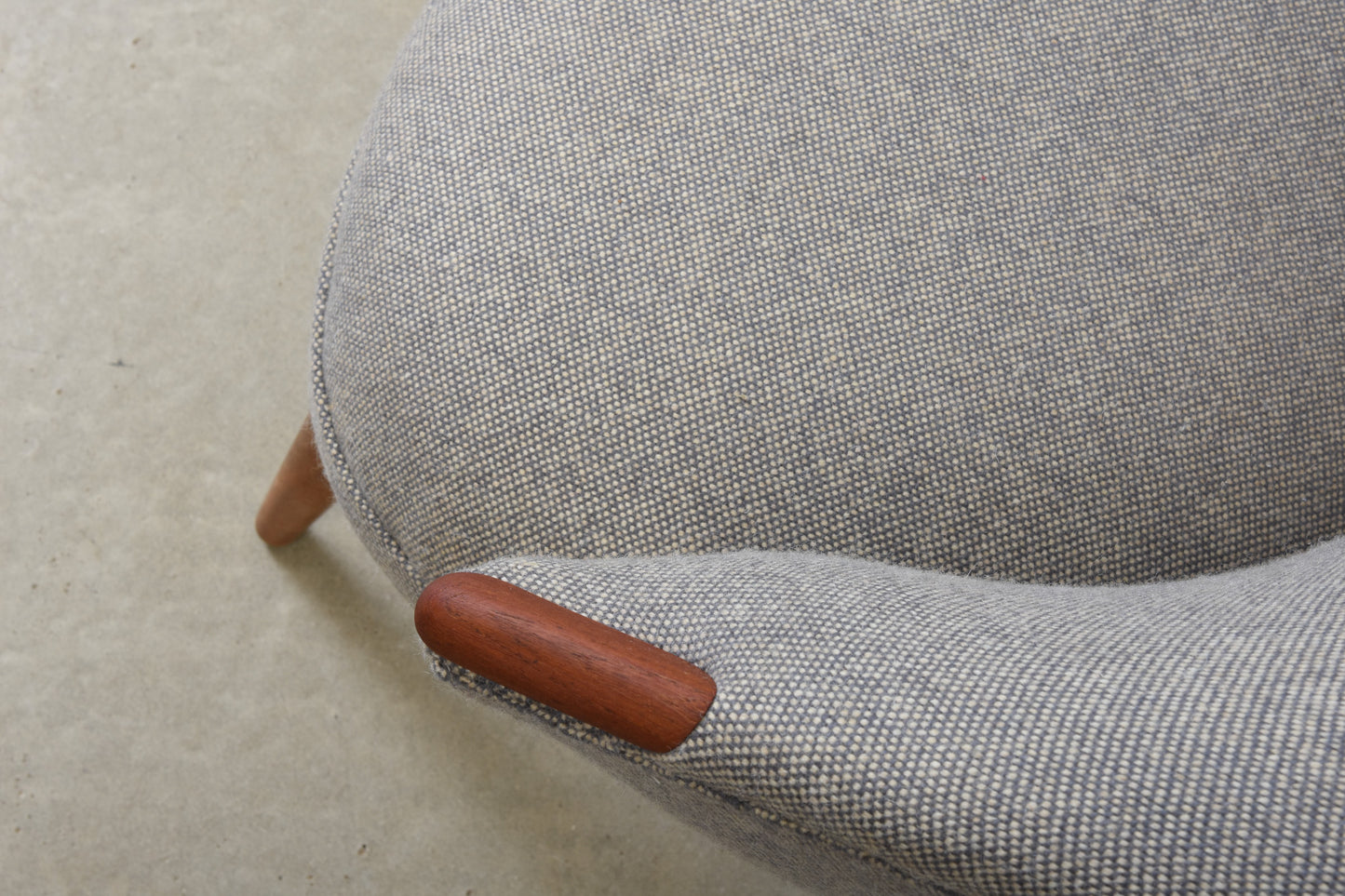 Newly reupholstered: 1950s occasional chair with teak paws