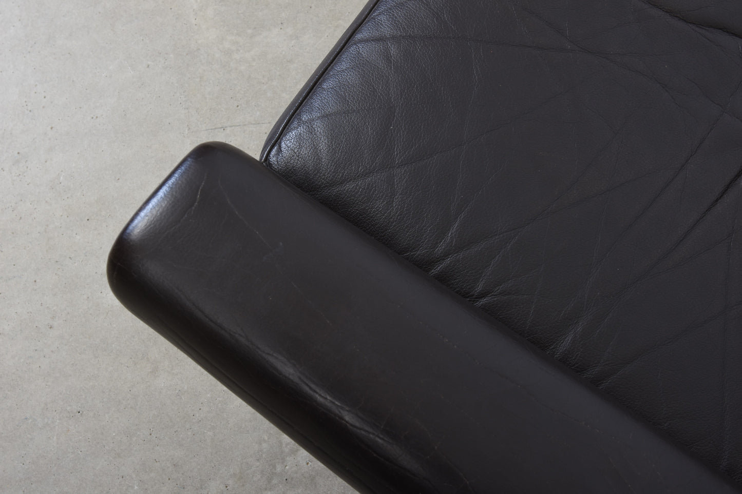 1960s leather lounger on teak legs