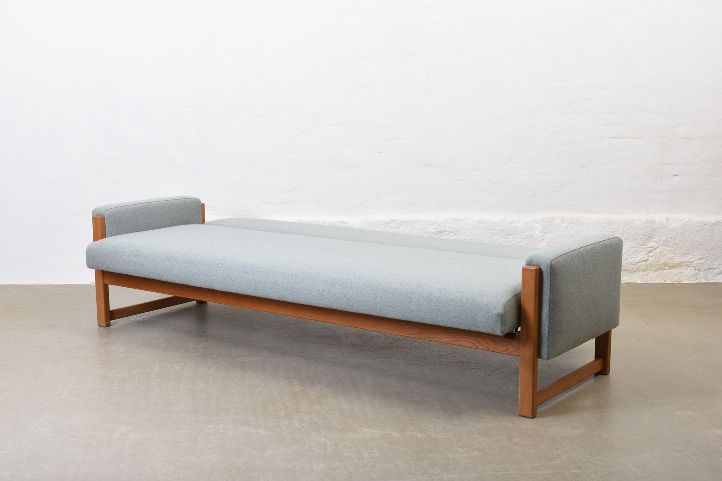 Newly reupholstered: 1960s oak sofa bed by Yngve Ekström