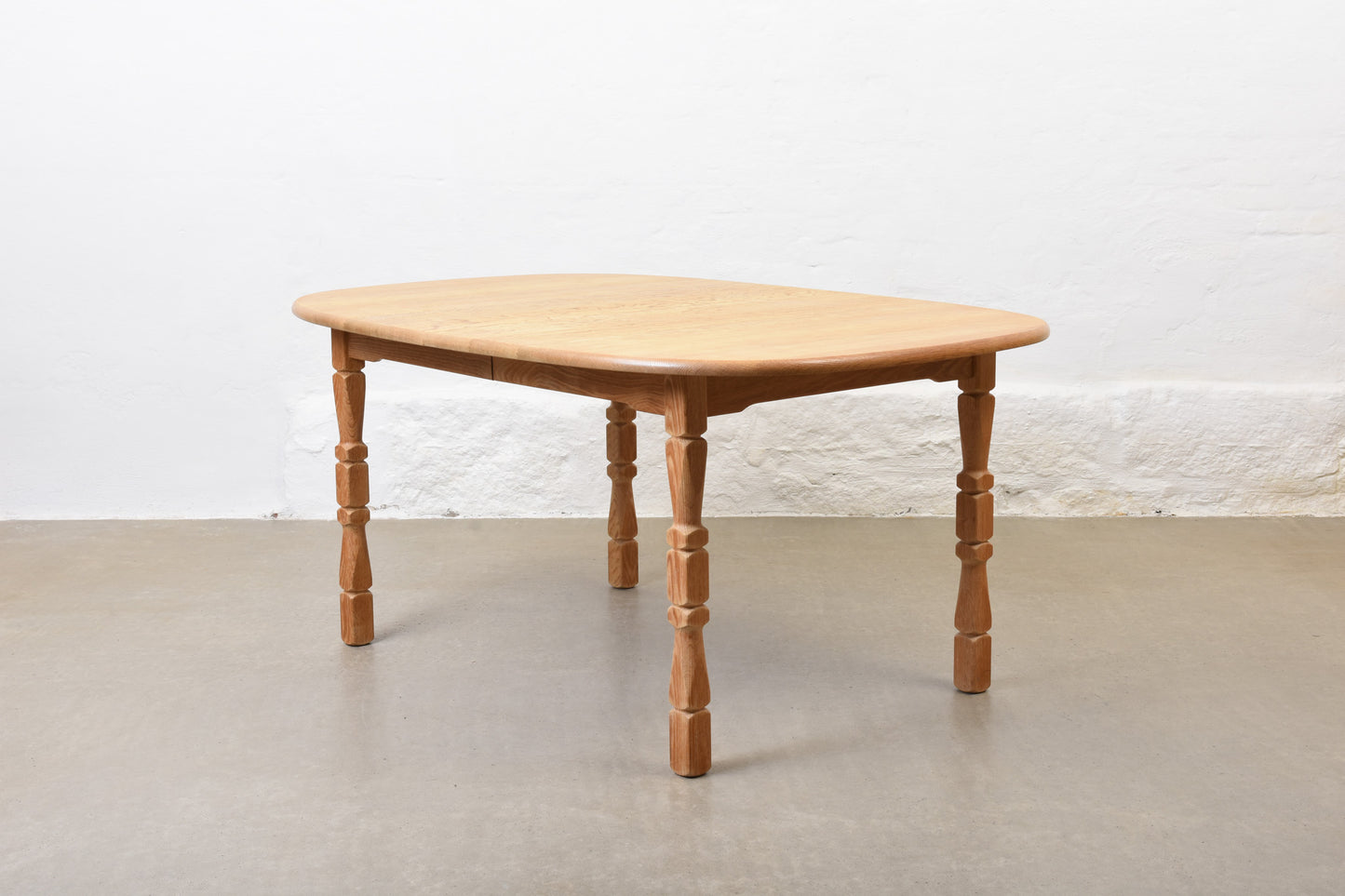 1970s extending oak dining table by Henning Kjærnulf