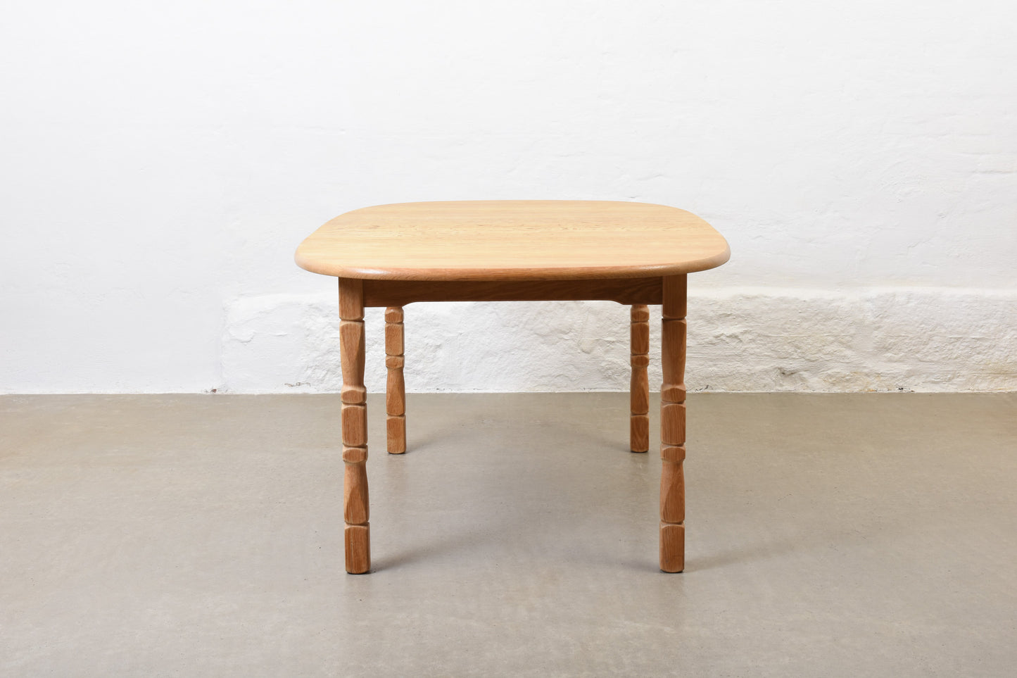 1970s extending oak dining table by Henning Kjærnulf