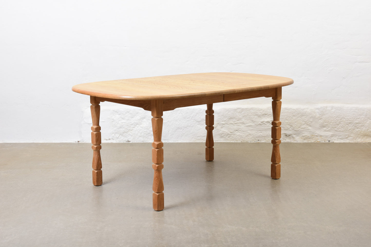 1970s extending oak dining table by Henning Kjærnulf