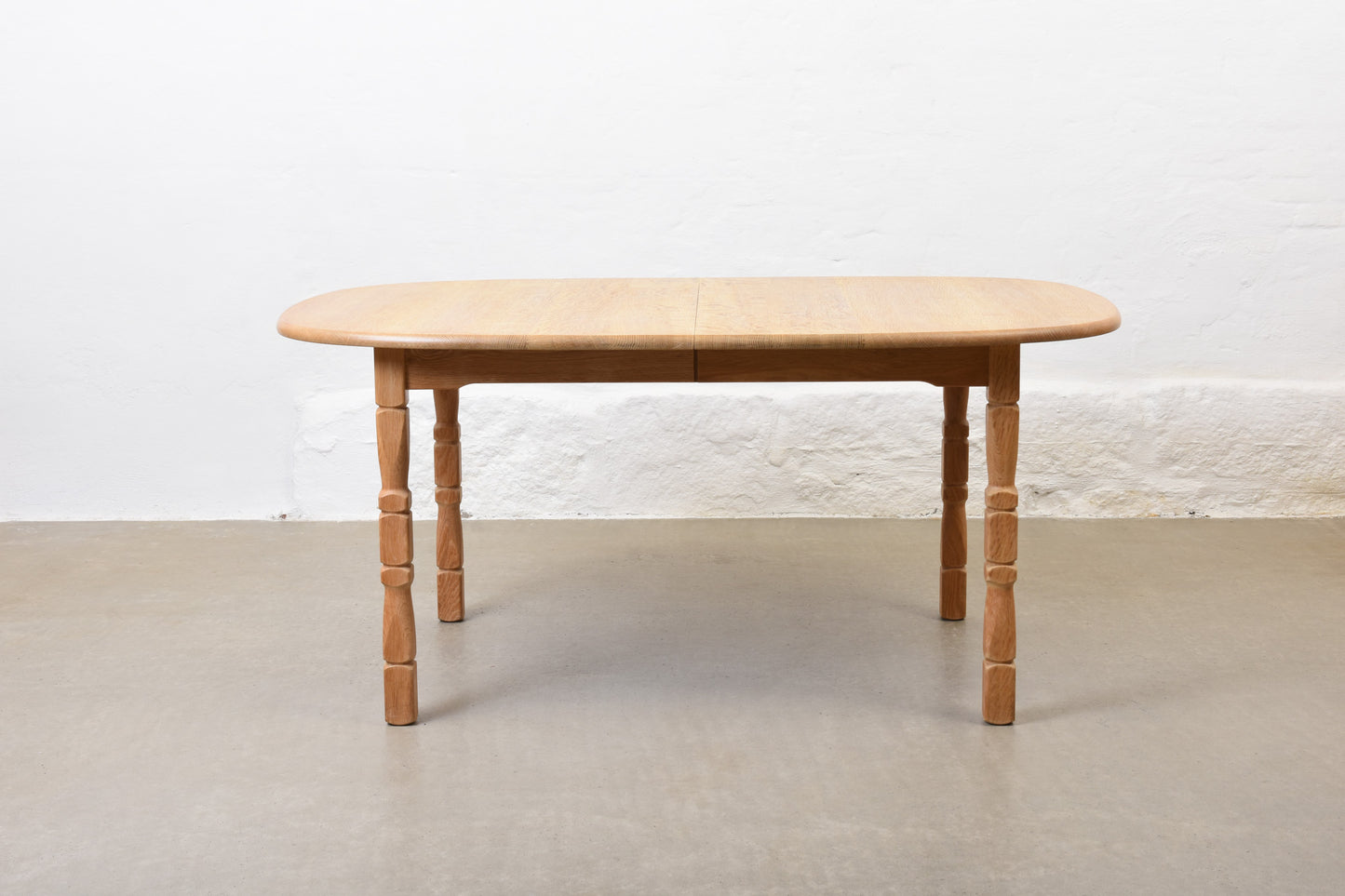1970s extending oak dining table by Henning Kjærnulf