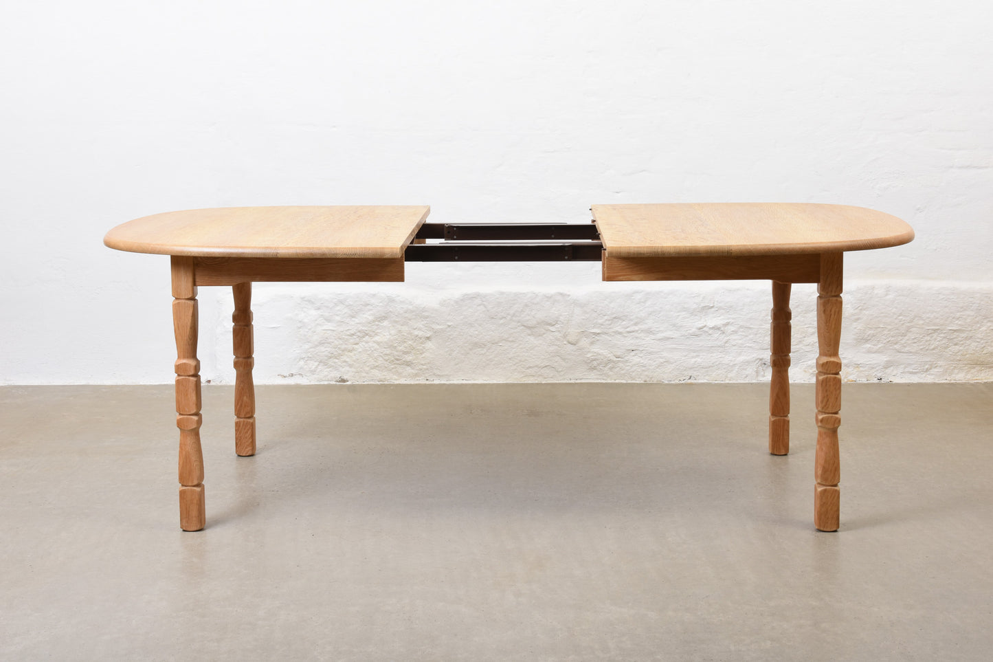 1970s extending oak dining table by Henning Kjærnulf