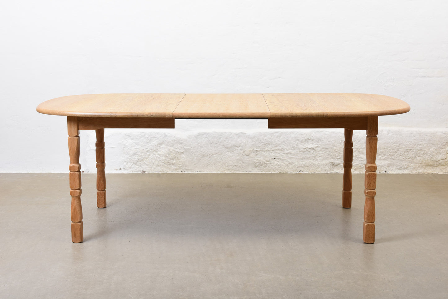1970s extending oak dining table by Henning Kjærnulf