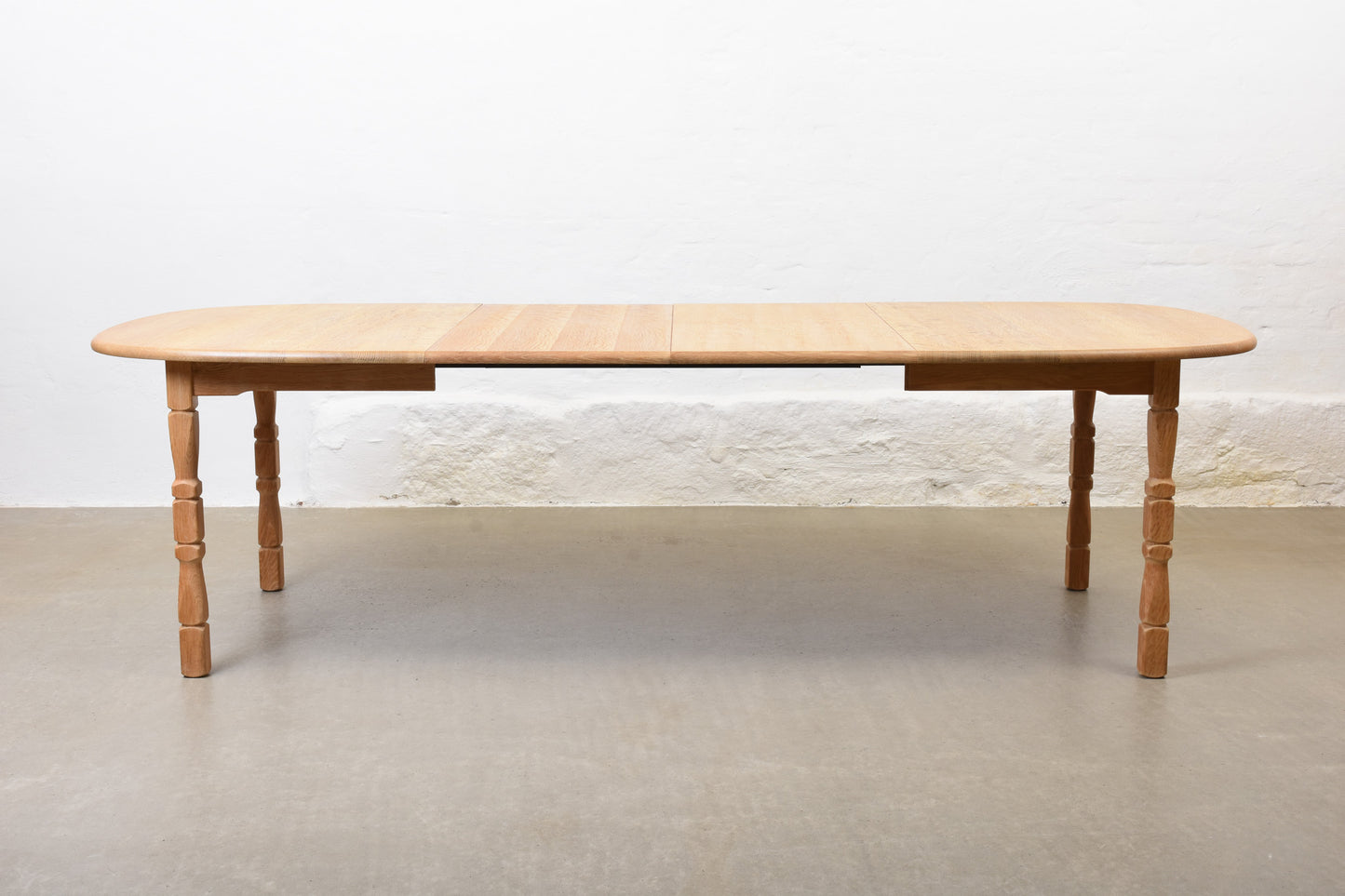 1970s extending oak dining table by Henning Kjærnulf