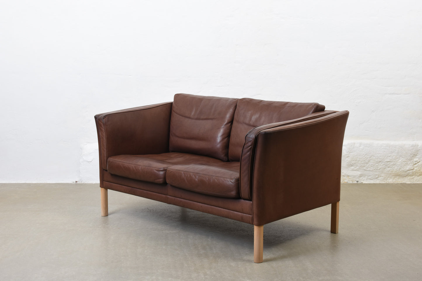 Vintage leather two seater by Mogens Hansen