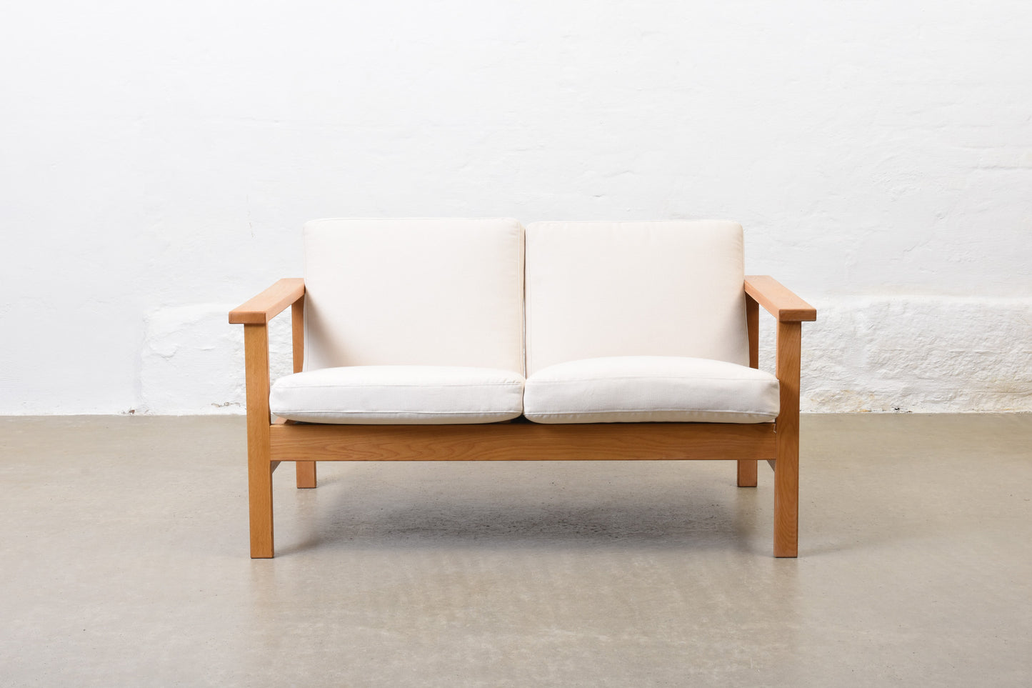 Newly reupholstered: 1960s oak + canvas two seater