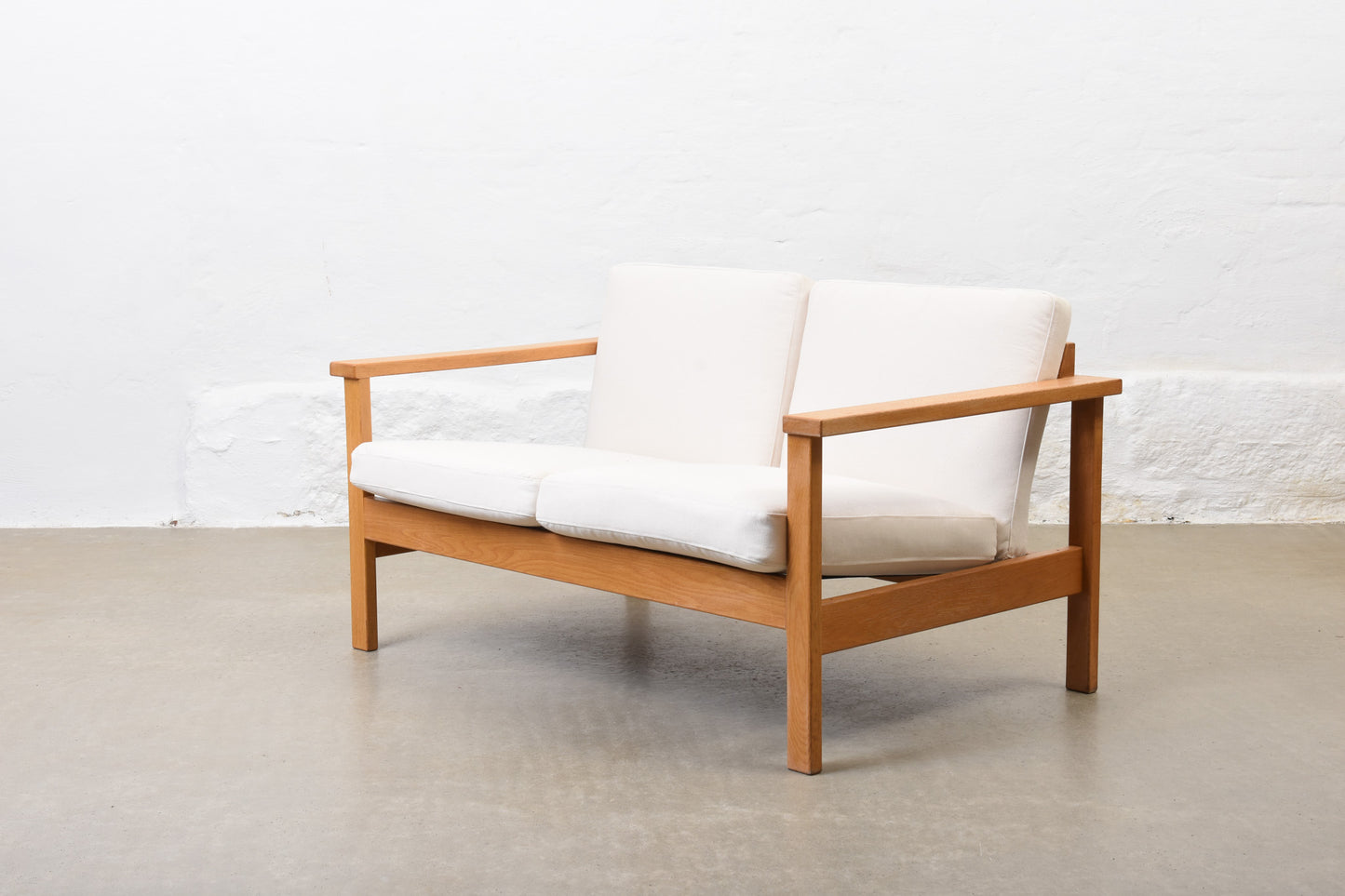 Newly reupholstered: 1960s oak + canvas two seater